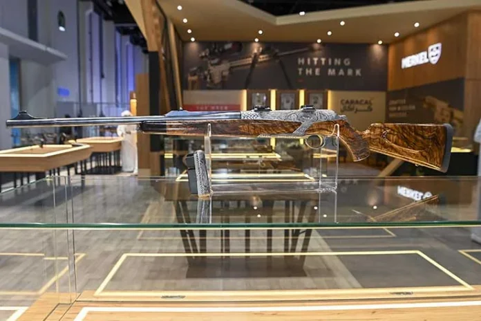 HELIX-Custom-hunting-rifle-engraved-with-the-new-Museum-of-the-Future-surrounded-by-desert-scenes-and-arabesques