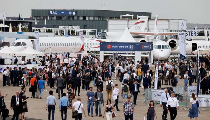 Visitors attend the International Paris Air Show at the Paris-Le Bourget Airport